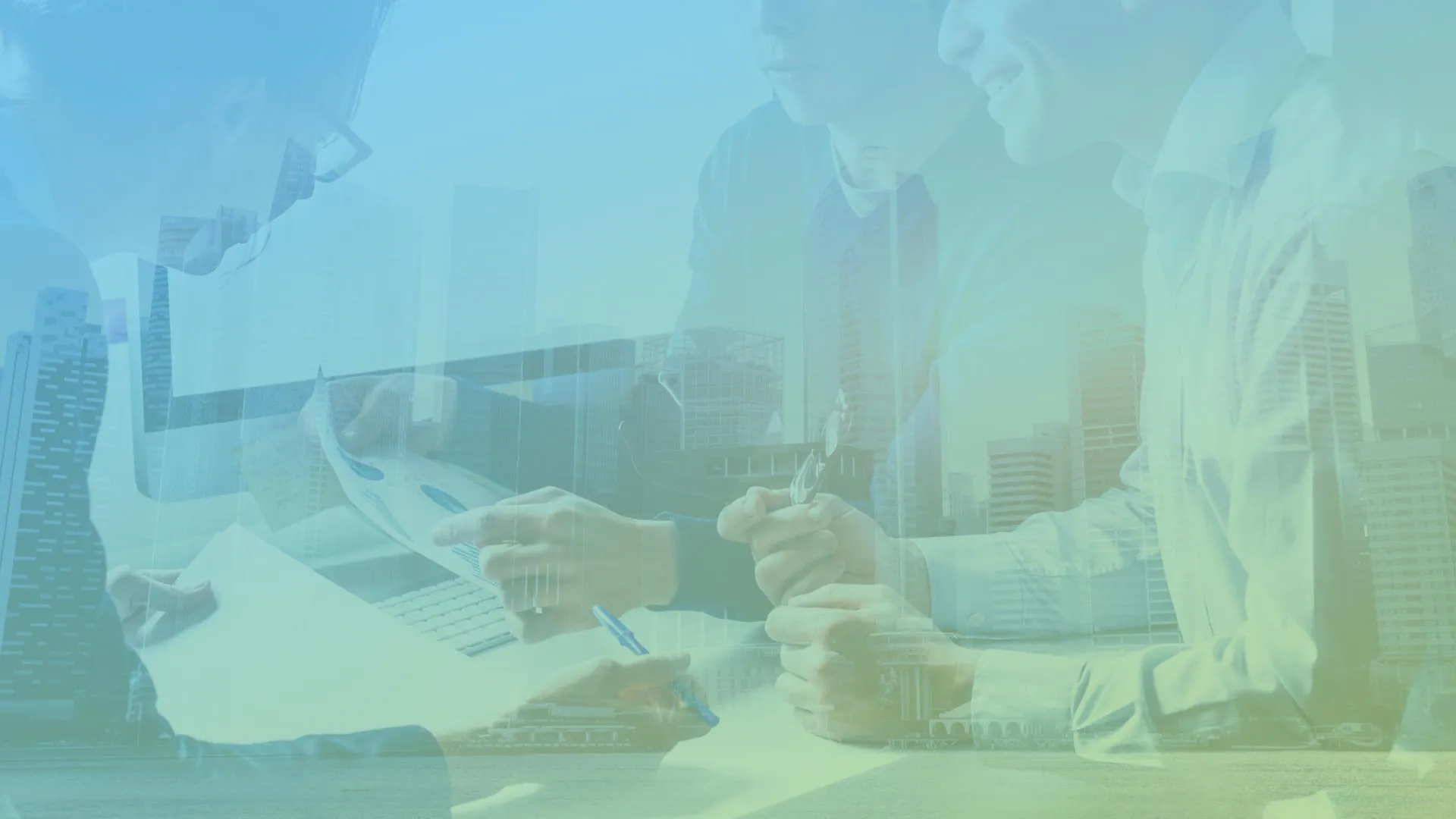 Business people silhouetted over city skyline